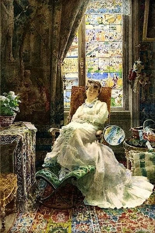 Donna in poltrona in un interno